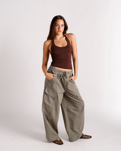 Dark brown ruched halter top with scoop neckline, worn with olive cargo pants