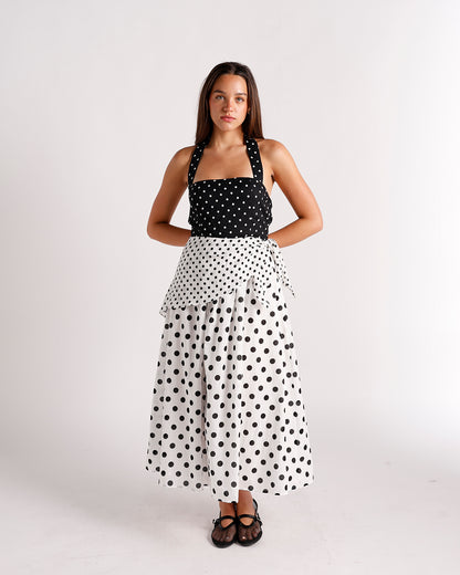 Black and white polka dot halter midi dress with tiered skirt and bow detail