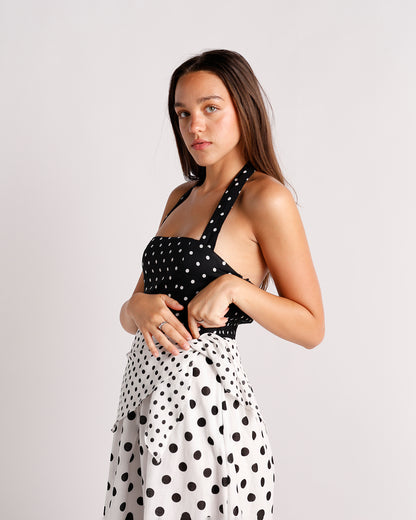 Black and white polka dot halter midi dress with contrast skirt