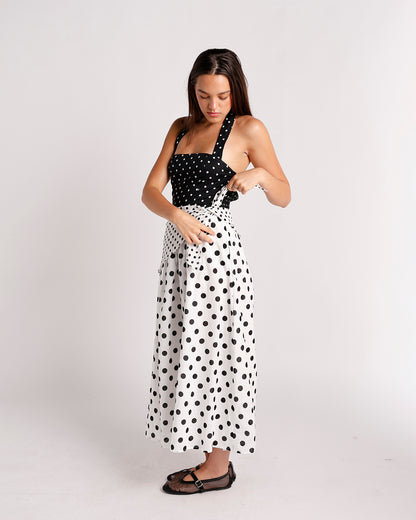 Black and white polka dot halter midi dress with contrast bodice and full skirt