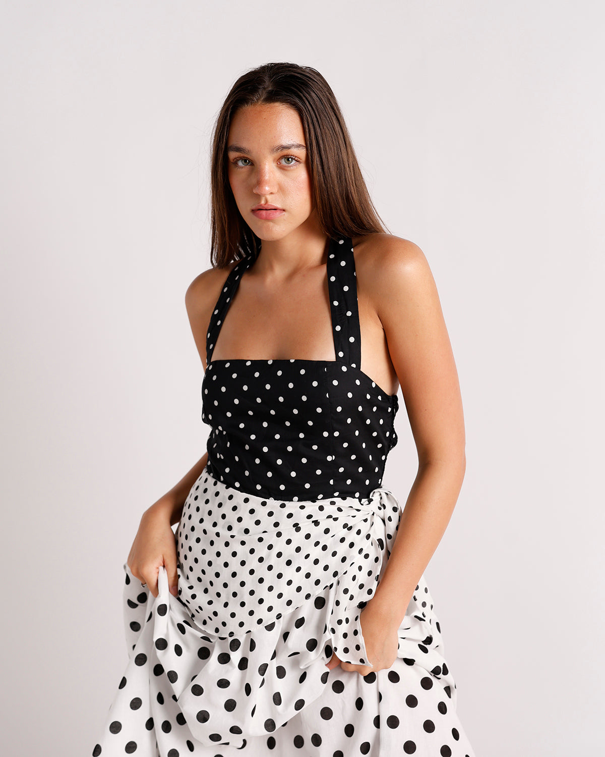Black and white polka dot halter midi dress with contrast skirt