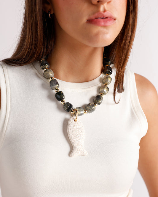 chunky green and gold beaded necklace with lava stone fish pendant