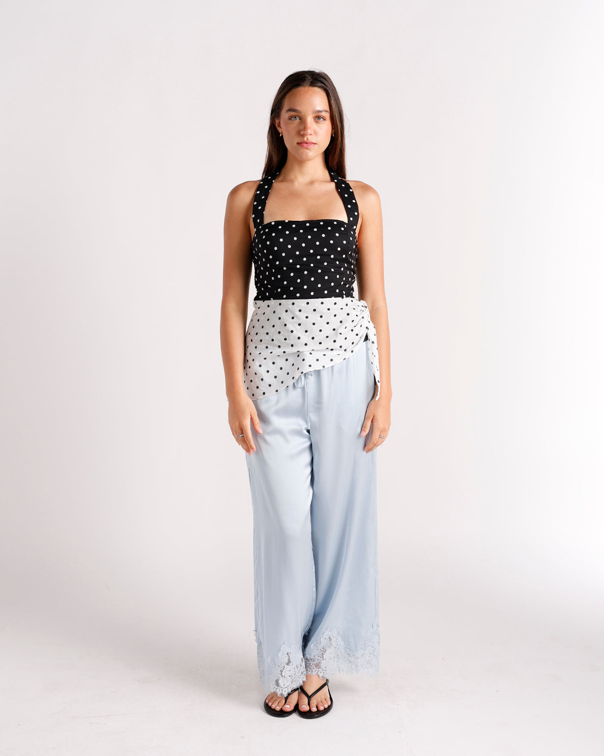 Black and white polka dot halter crop top with wrap detail
