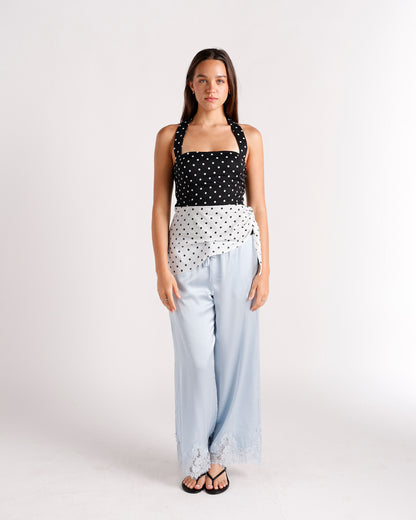 Black and white polka dot halter crop top with wrap detail