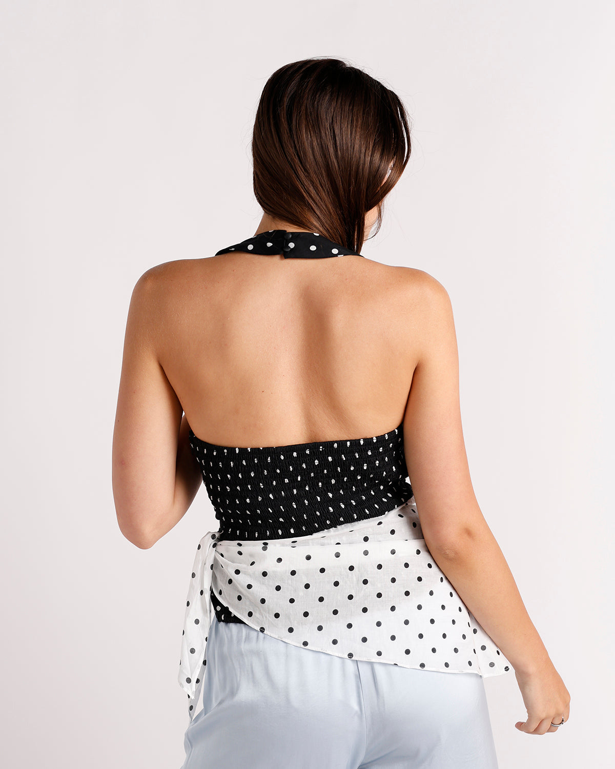 Black and white polka dot halter crop top with open back and tie detail