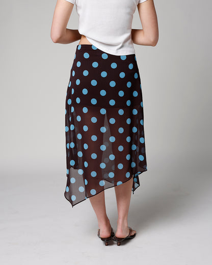 Black sheer midi skirt with blue polka dots and asymmetrical handkerchief hem