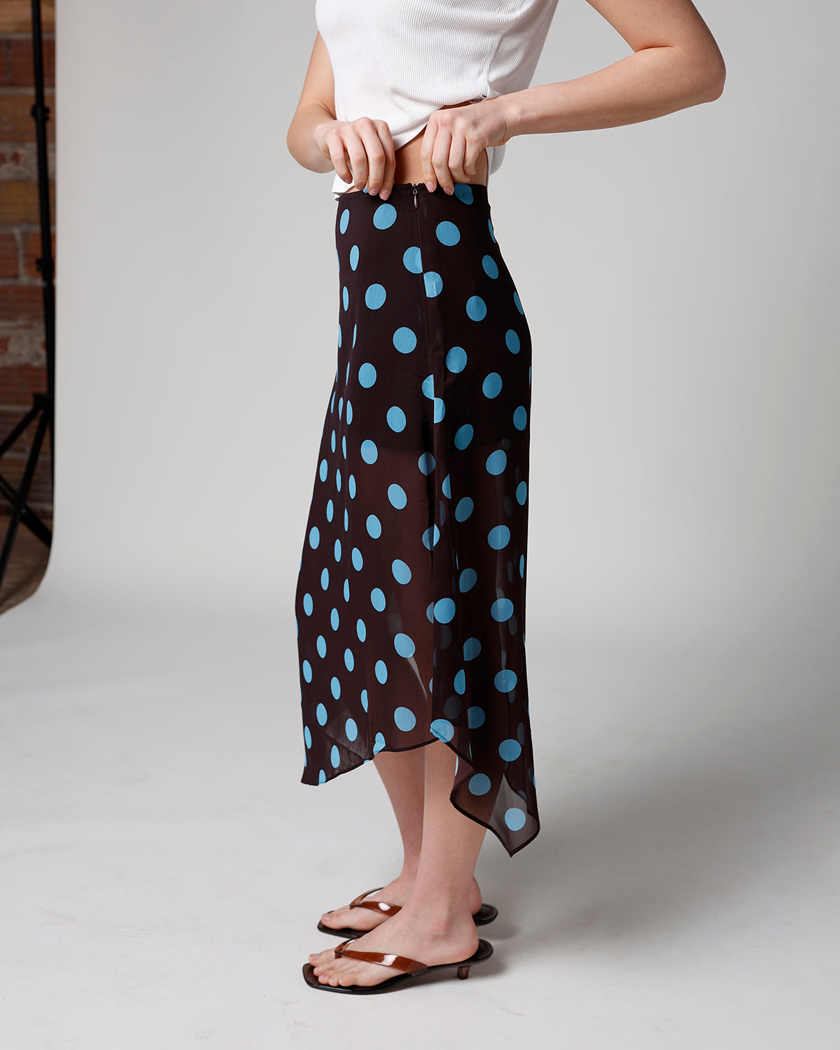 Black chiffon midi skirt with large blue polka dots and asymmetrical hem