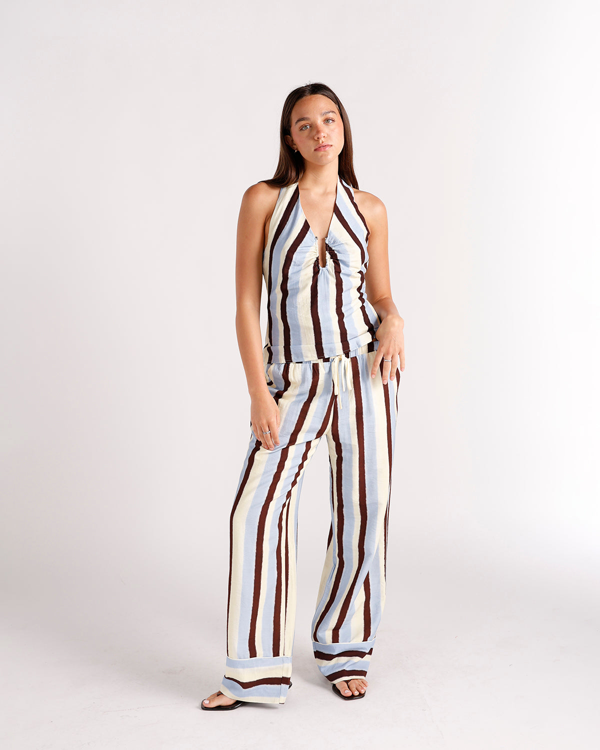 Wide-leg striped dressy pants in cream, blue, and brown with drawstring waist