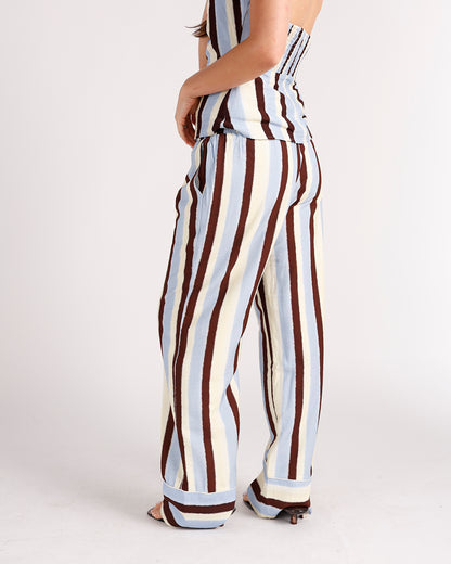 Wide-leg striped pants in blue, cream, and brown with elastic waistband