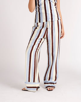 Wide-leg striped pants in blue, cream, and burgundy with drawstring waist and cuffed hem