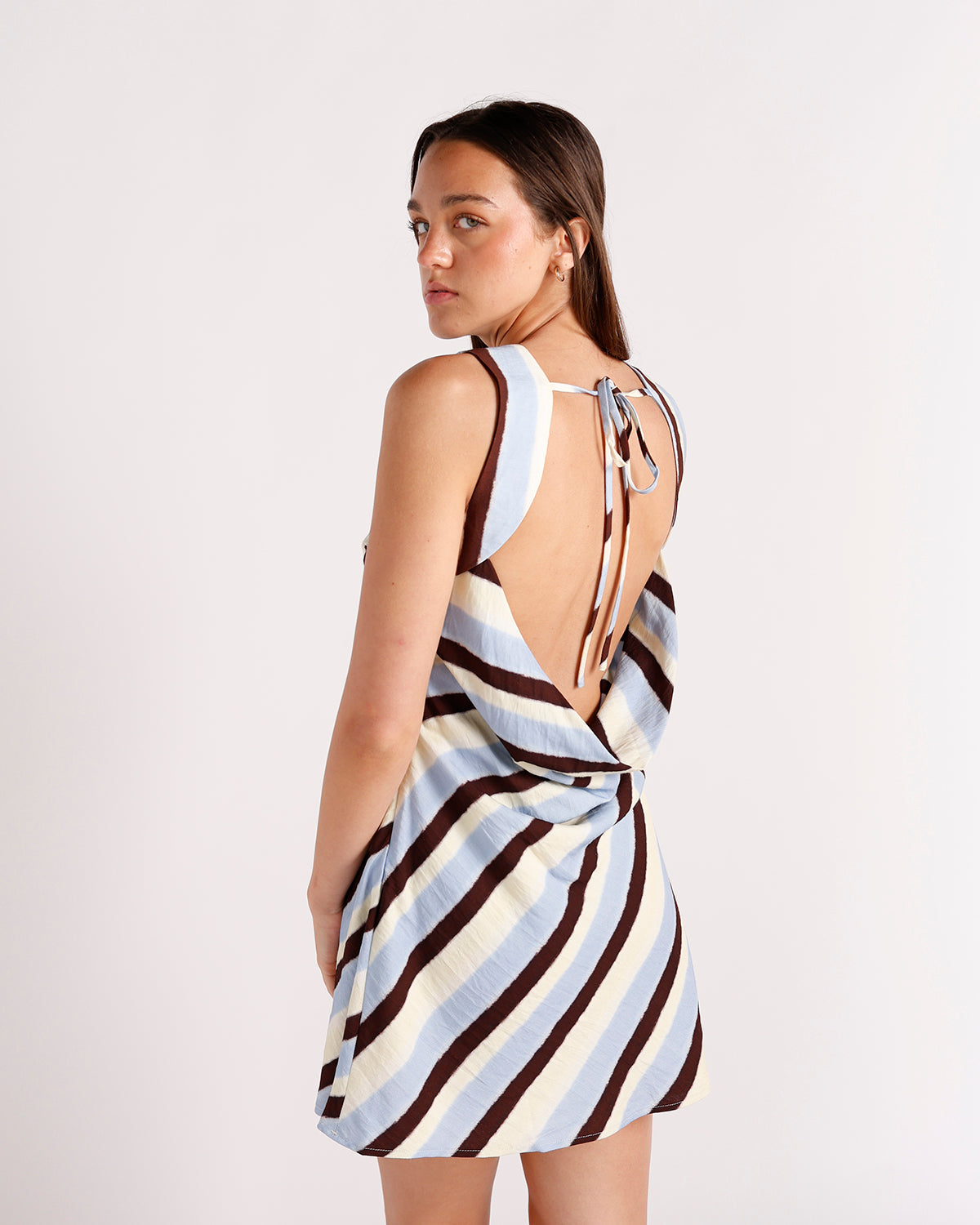 Striped mini dress with open back tie detail in blue, brown, and cream
