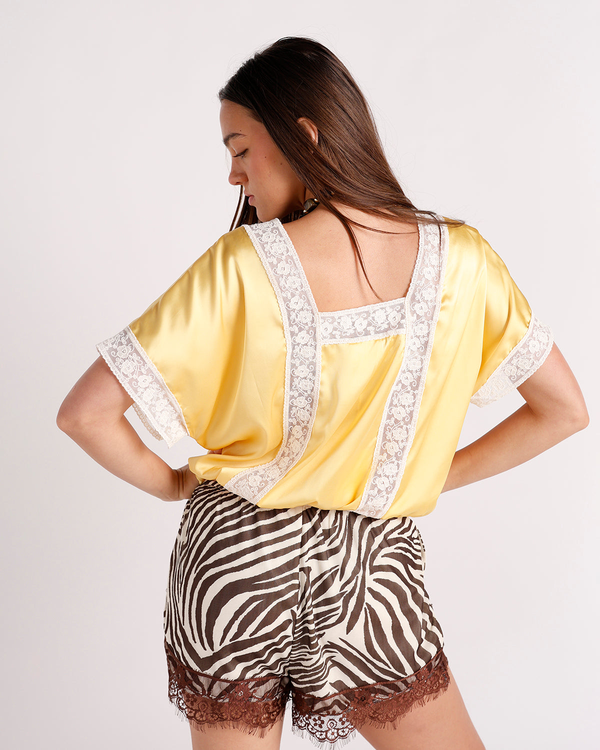 Yellow satin top with white floral lace trim on back and sleeves