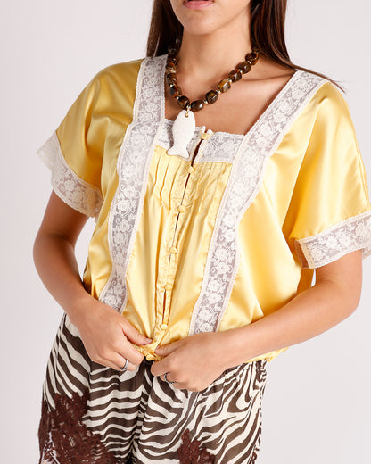 Yellow satin short-sleeve top with white floral lace trim and button front