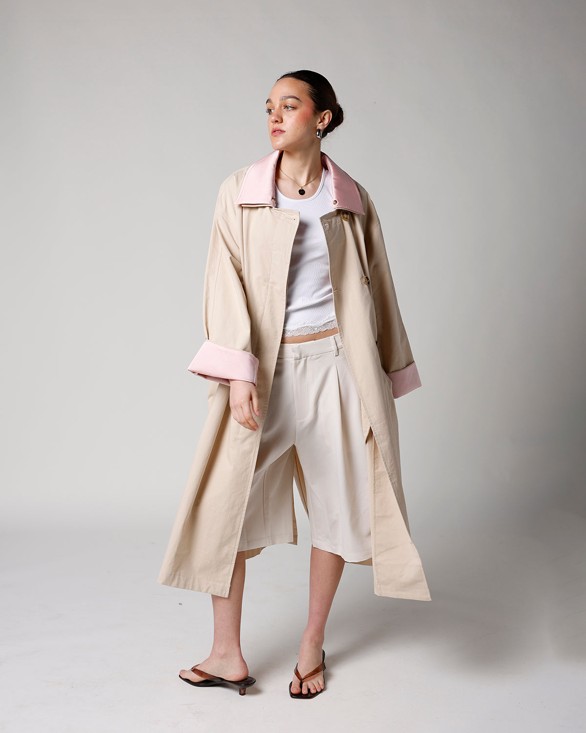 beige trench coat with removable light pink collar and cuffs