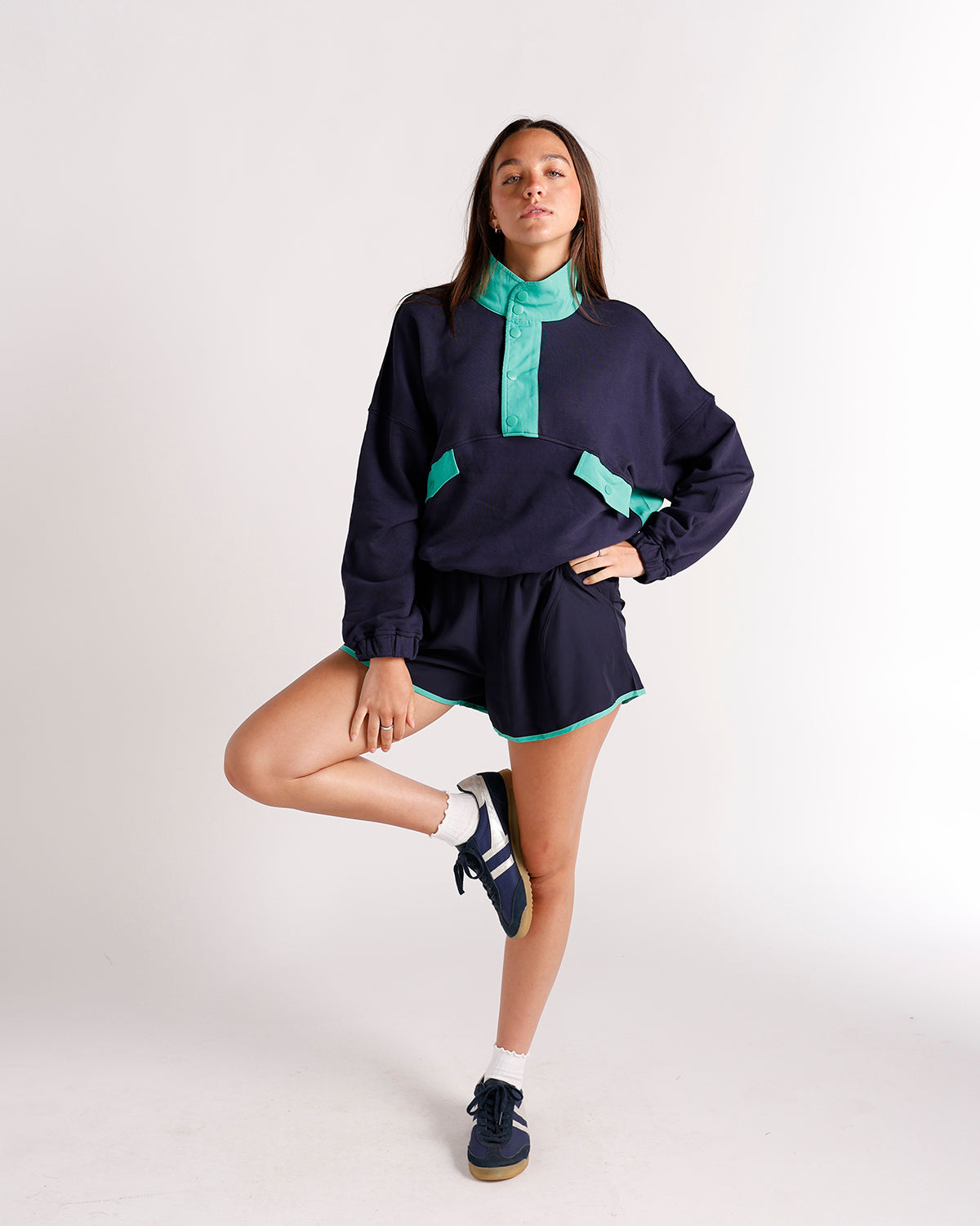 Navy blue and teal color-block pullover sweatshirt with matching shorts set