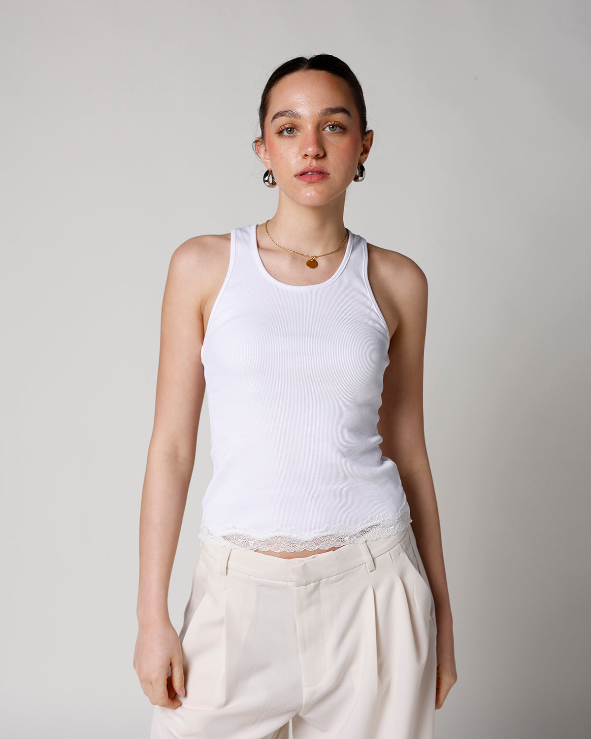white tank top with lace hem details racerback scoop neckline white tank top