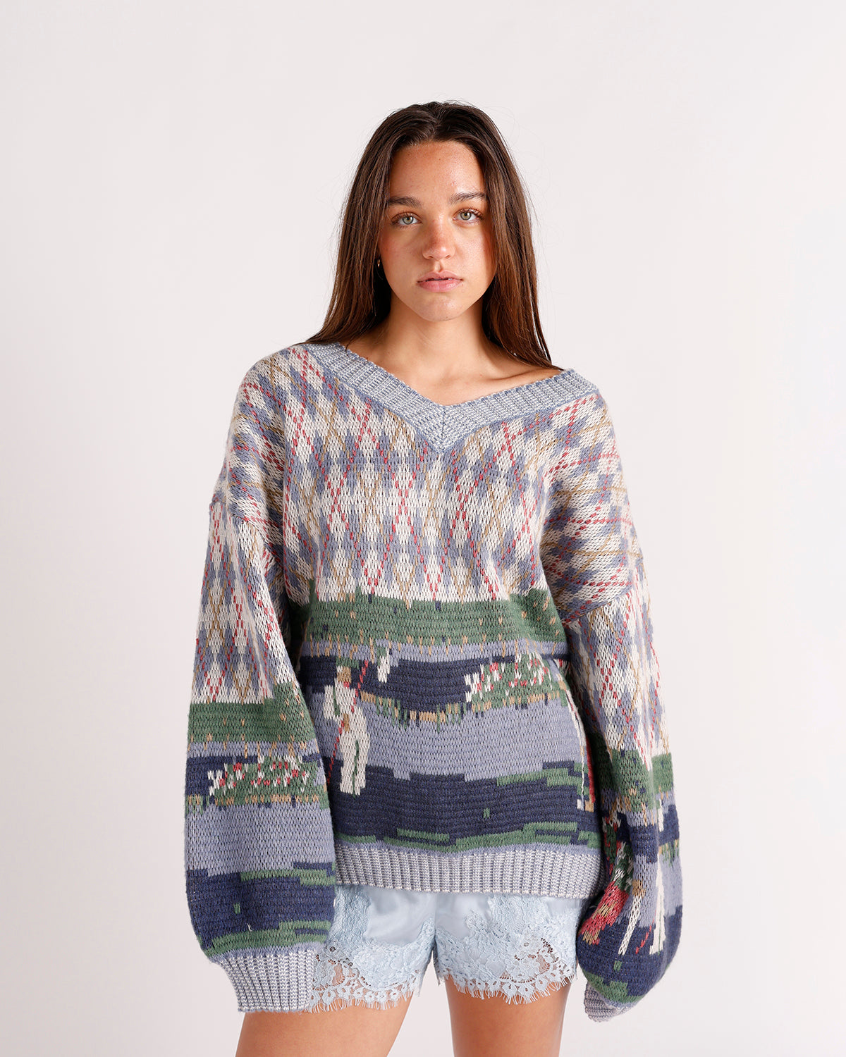 blue and green golf print v neck sweater