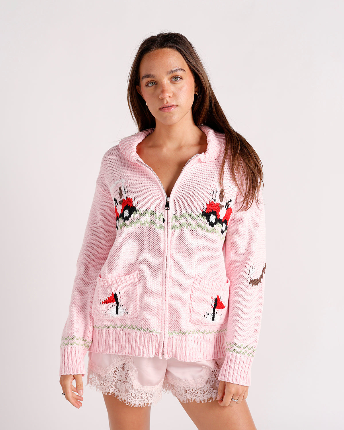 pink zip up golf themed cardigan sweater