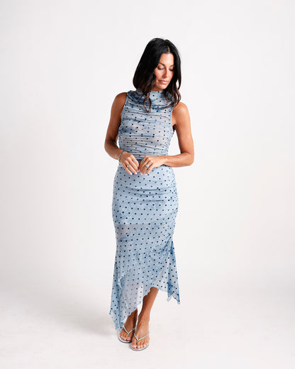 Blue polka dot ruched mesh midi dress with mock neck and asymmetric hem