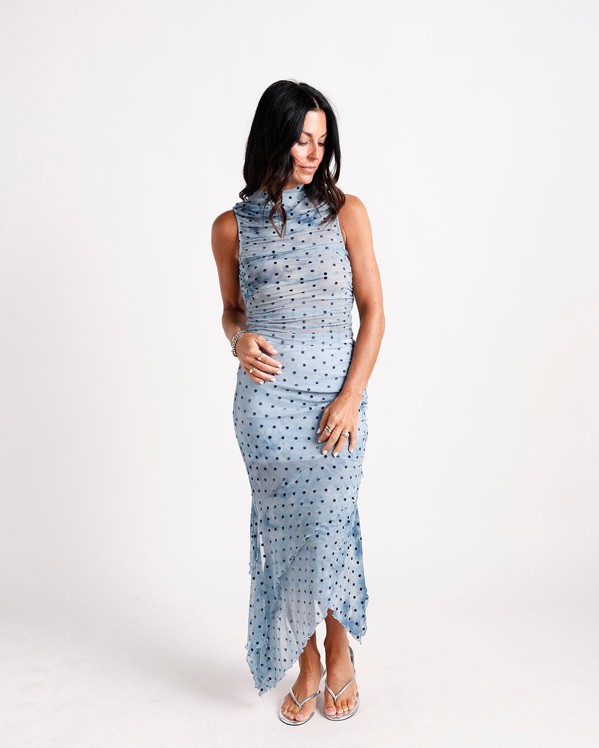 Blue polka dot ruched mesh midi dress with high neck and ruffle hem