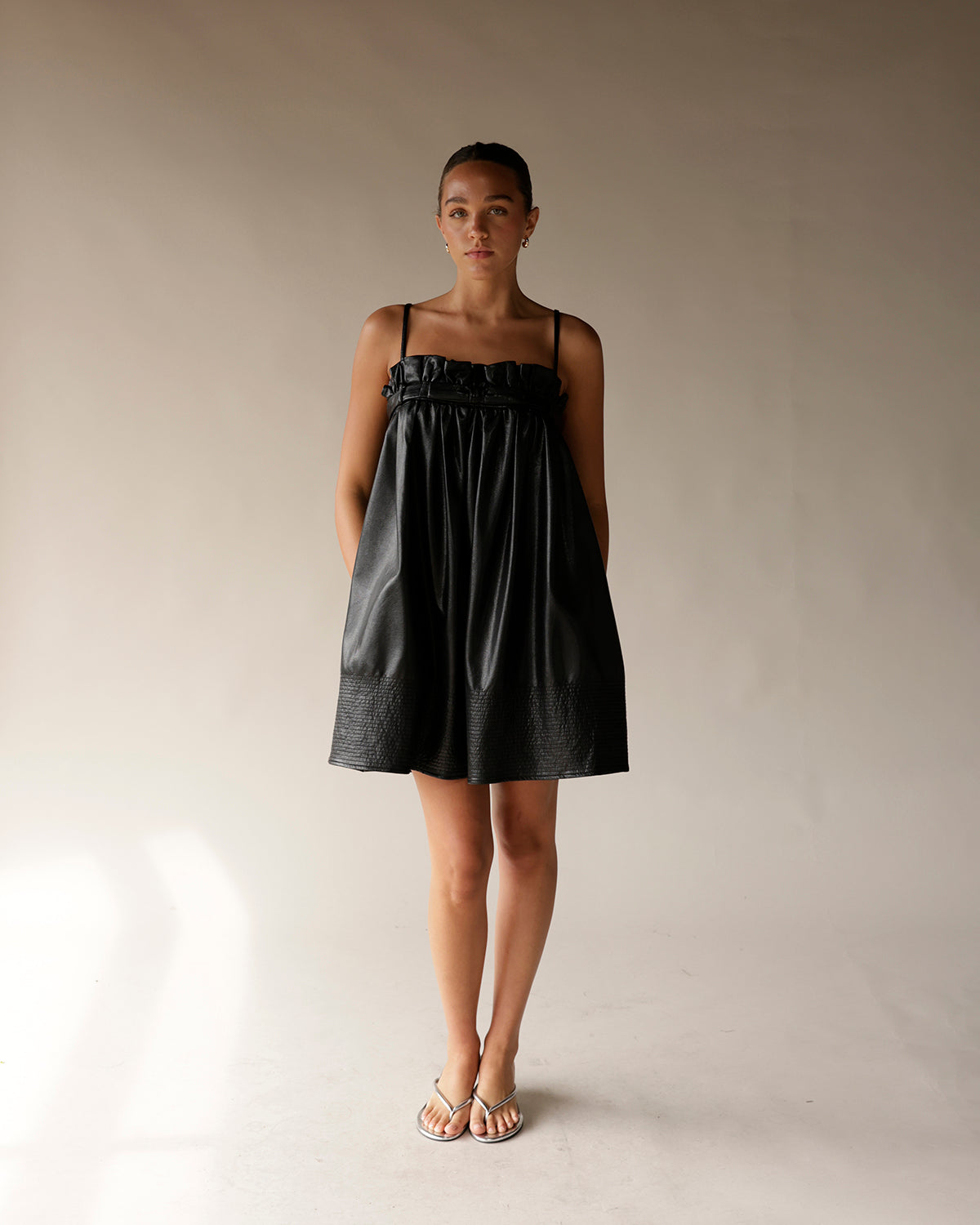 BOW LOVE FAUX LEATHER BLACK MINI DRESS