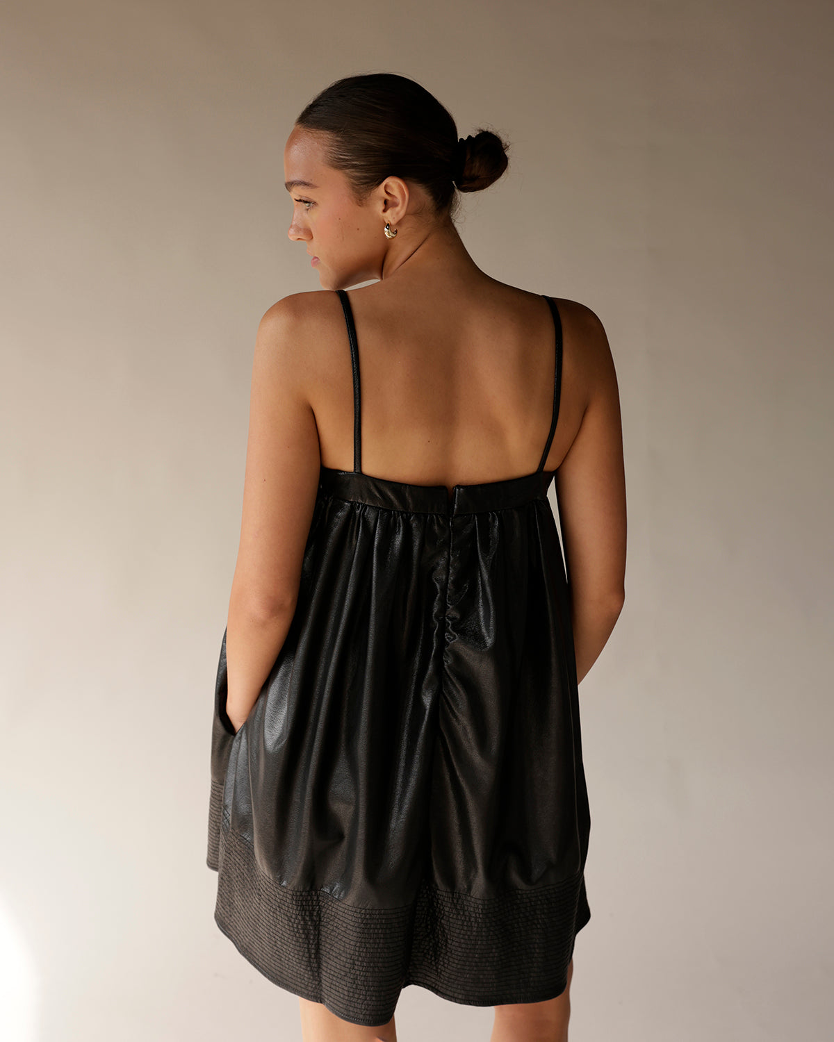 BOW LOVE FAUX LEATHER BLACK MINI DRESS