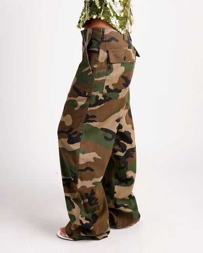 Wide-leg camouflage cargo pants with side flap pockets, green brown black pattern
