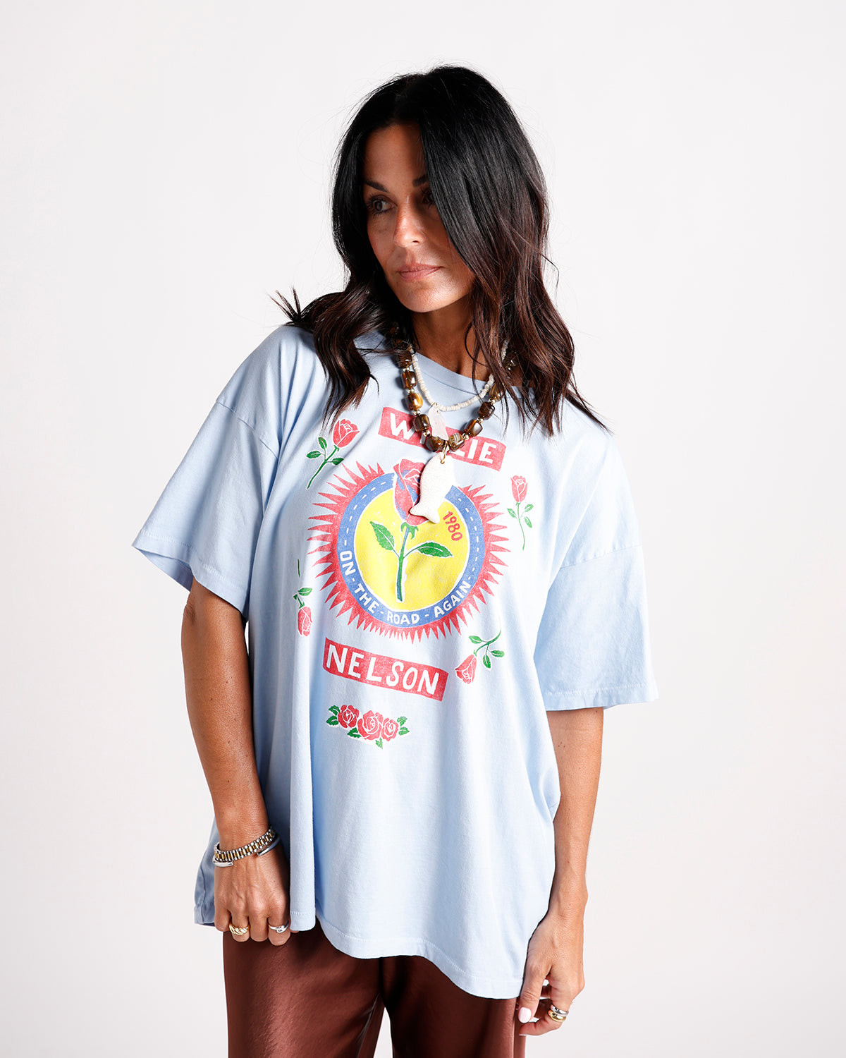 Oversized light blue graphic tee with Willie Nelson On The Road Again rose print