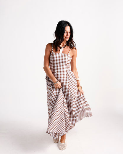 Brown and white gingham maxi dress with spaghetti straps and flowy skirt