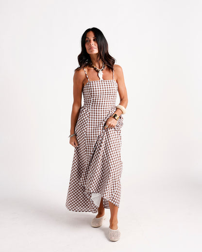Brown and white gingham maxi dress with spaghetti straps and ruffle skirt