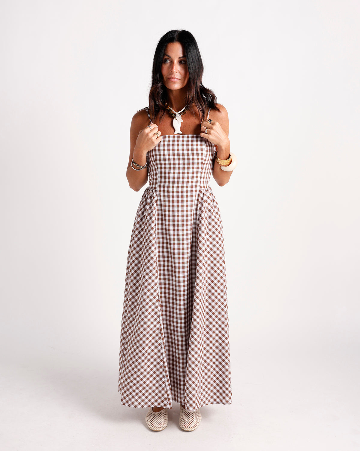 Brown and white gingham check maxi dress with fitted bodice and full skirt
