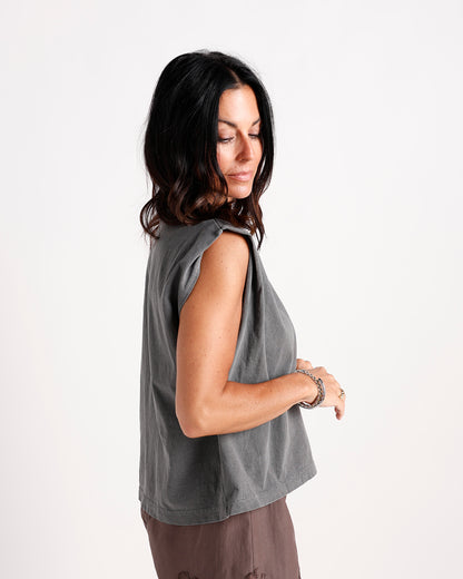 Washed gray sleeveless muscle tee with structured shoulders, side profile view.