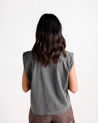Back view of a charcoal gray sleeveless muscle tee with structured shoulders