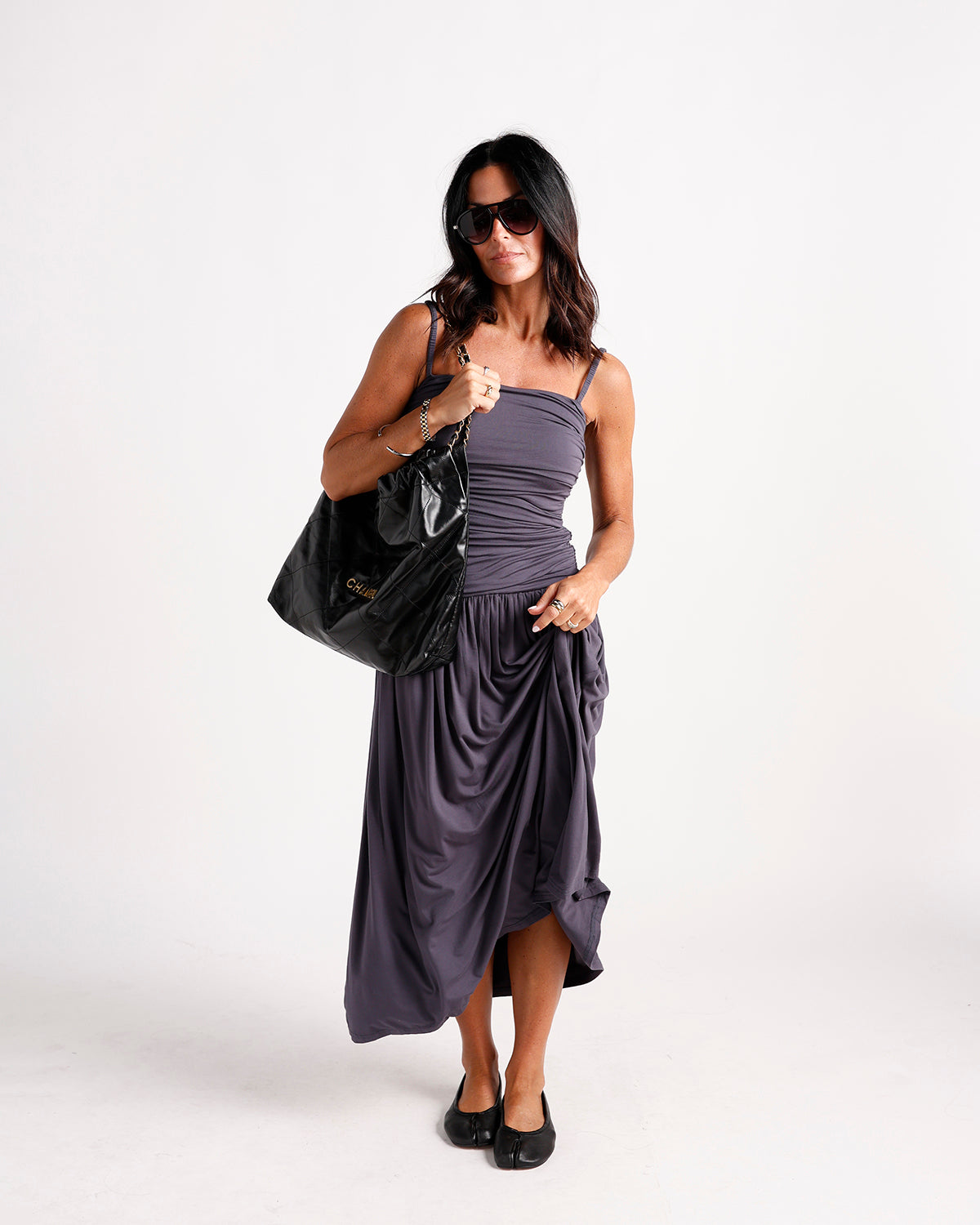 Draped dark purple midi dress with ruched bodice and thin straps