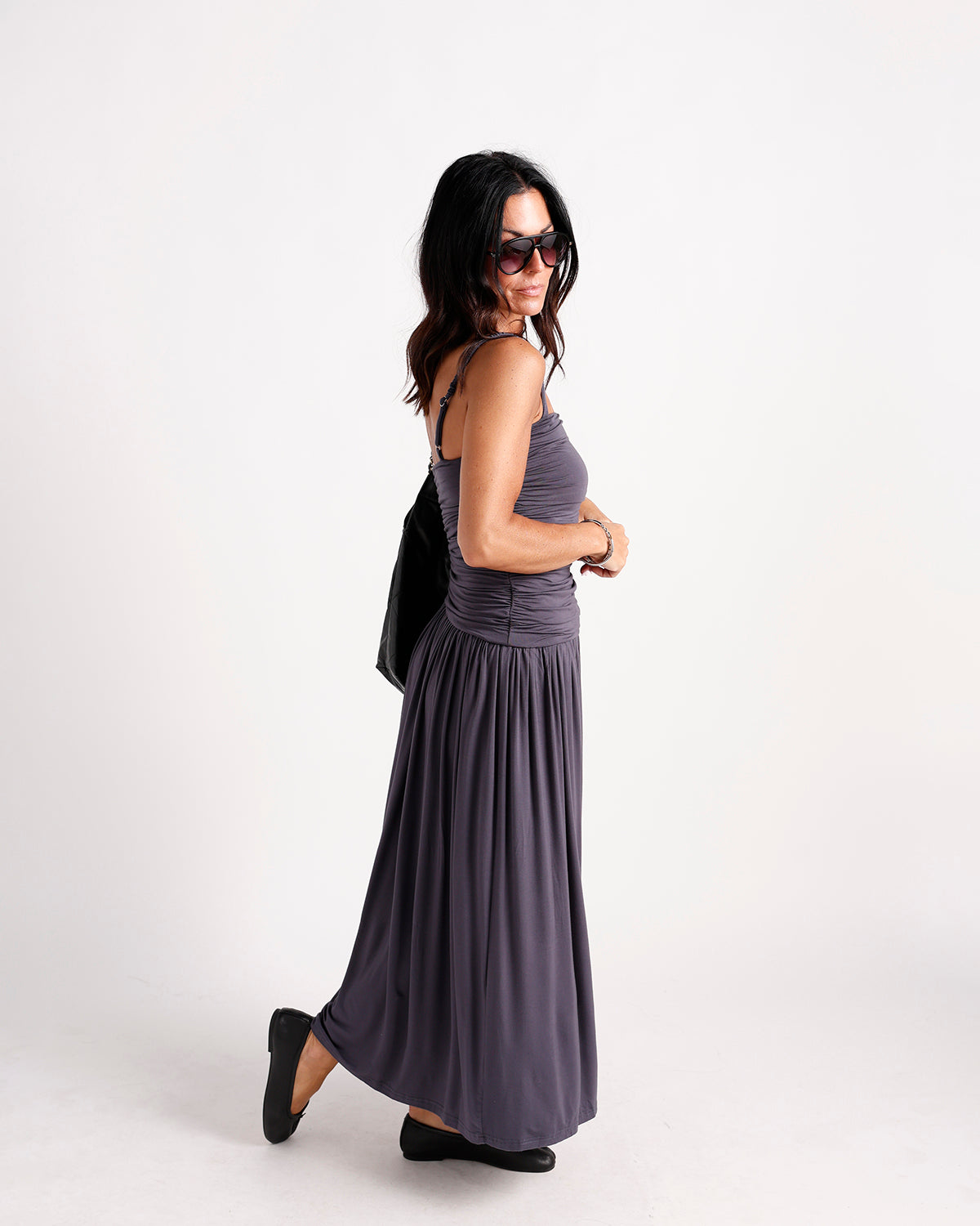Women's ruched maxi dress in dark gray with spaghetti straps and flowy skirt