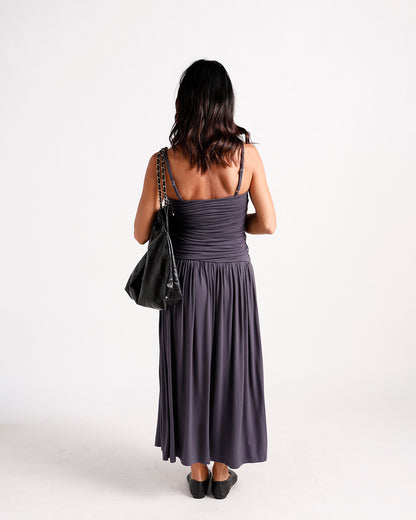 Dark gray ruched maxi dress with spaghetti straps, shown from back view