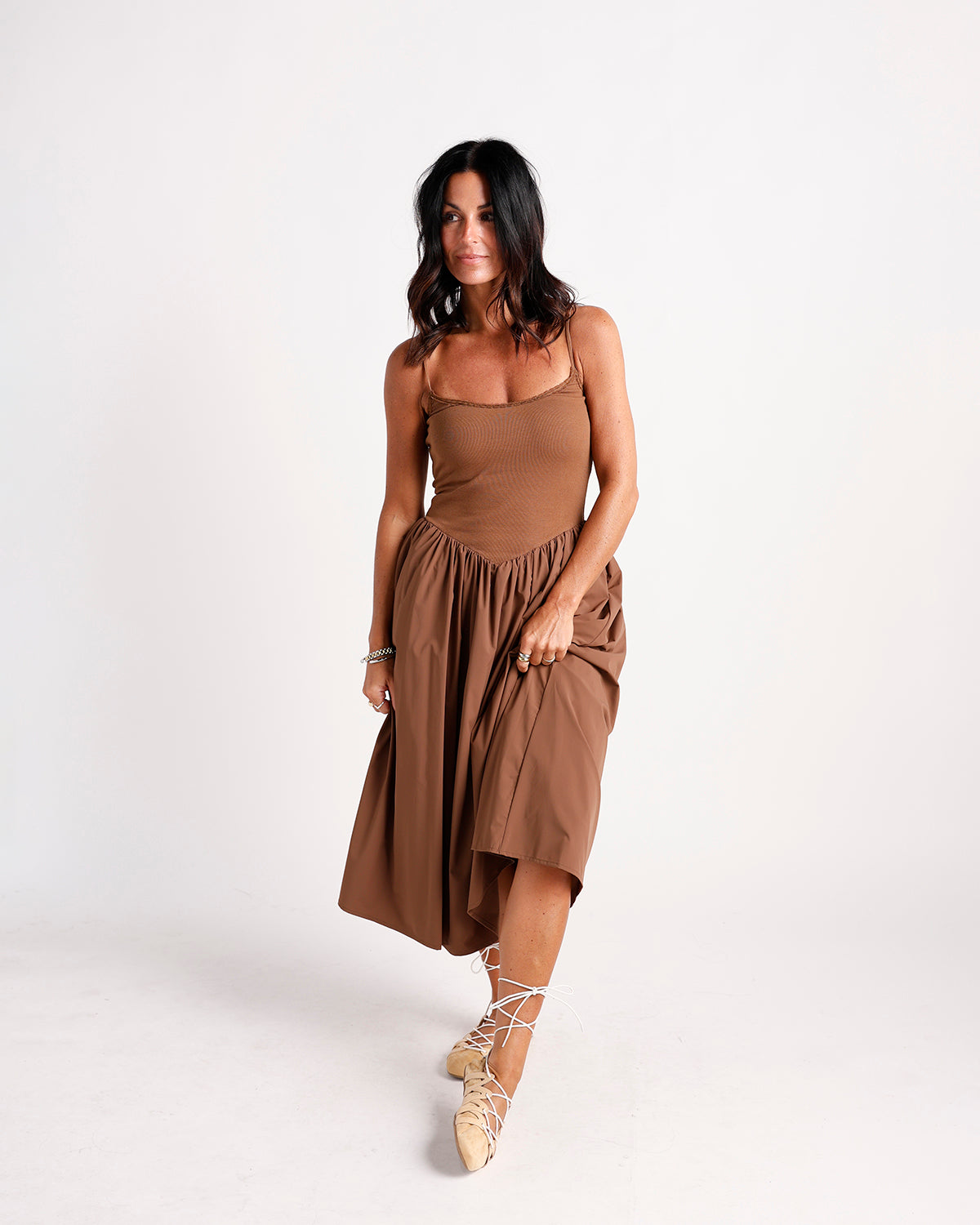 Brown drop waist midi dress with ribbed bodice, full skirt, and spaghetti straps