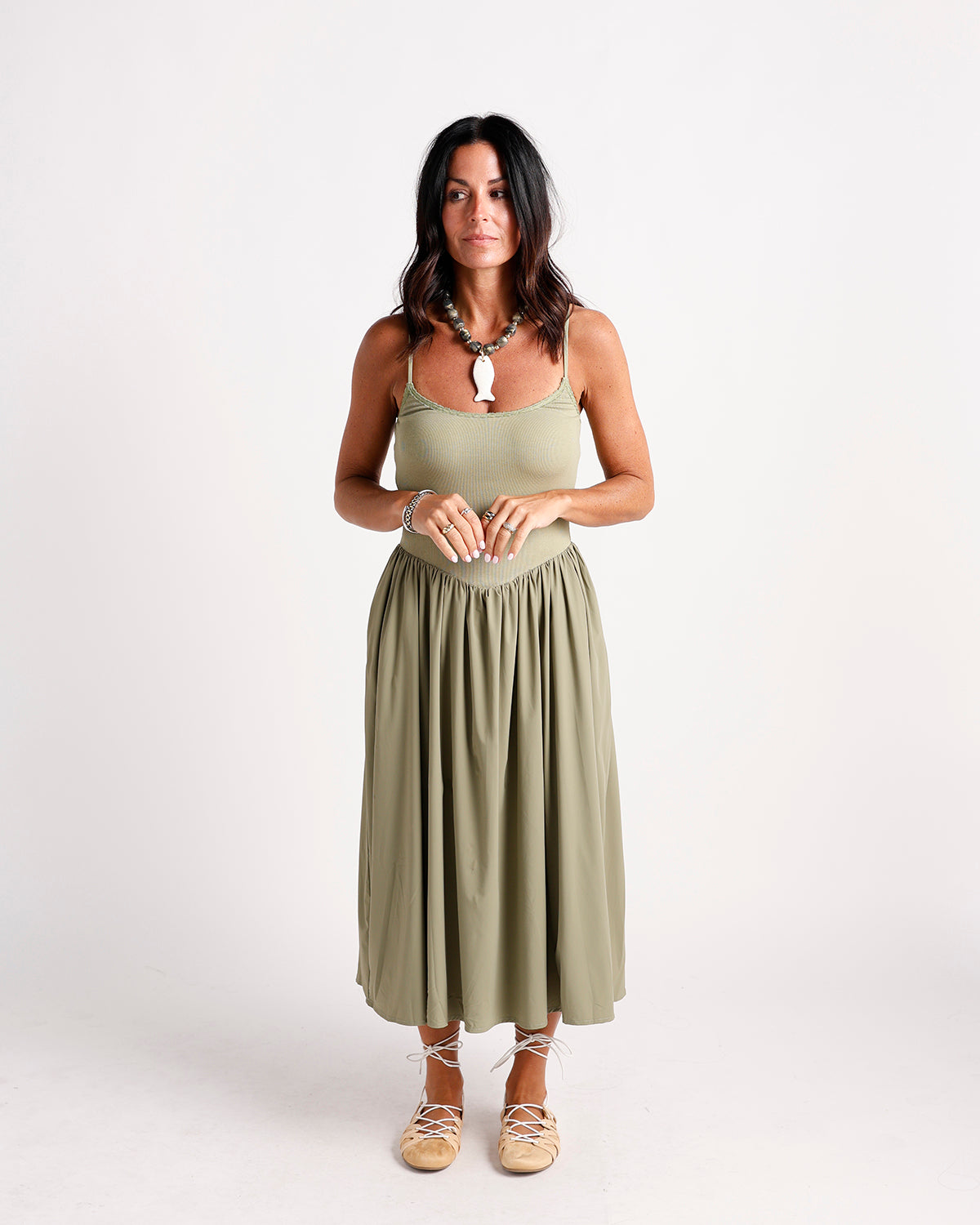 Olive green drop waist midi dress with spaghetti straps and gathered skirt