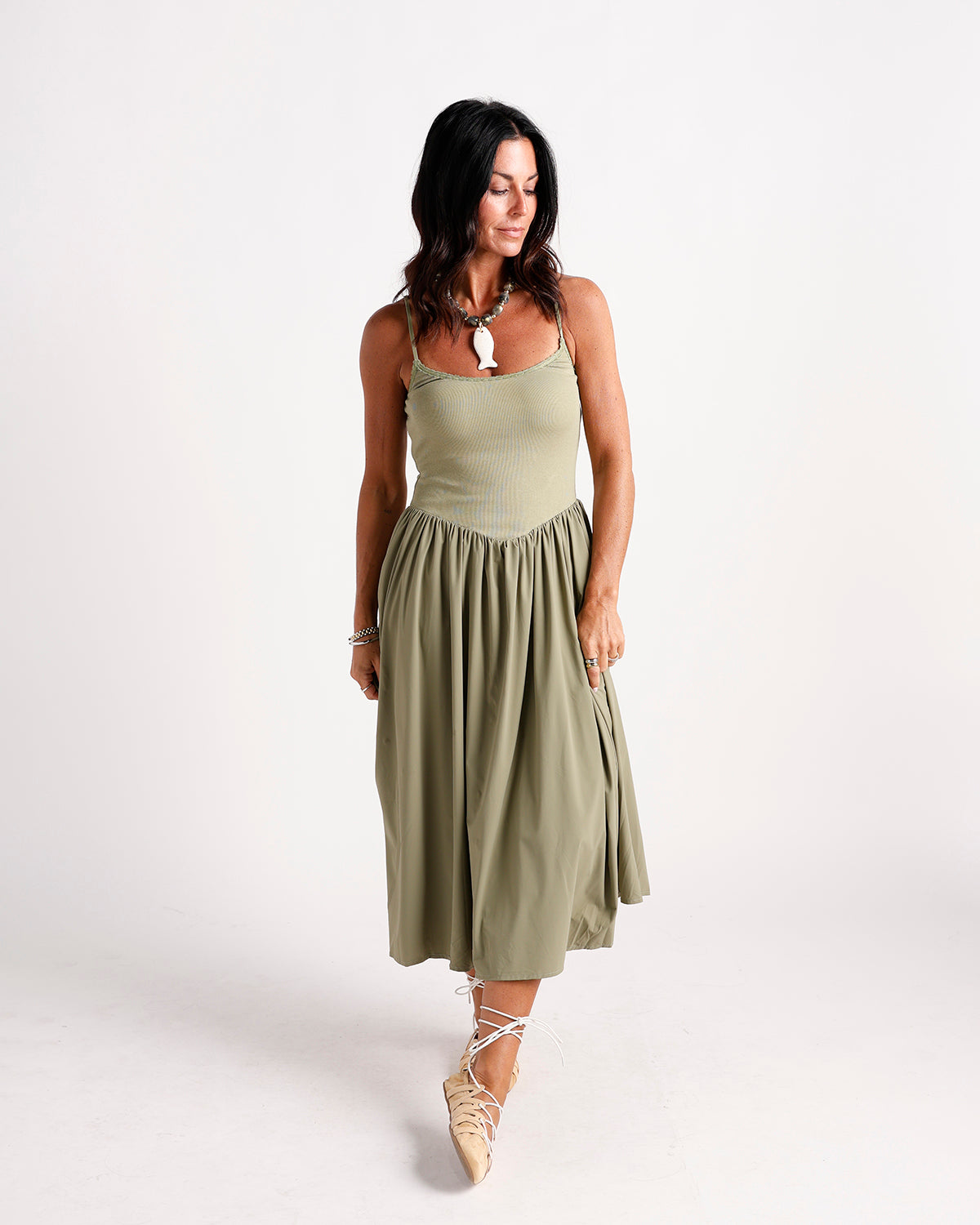 olive green drop waist midi dress with ribbed bodice and adjustable spaghetti straps