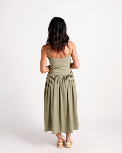 Olive green drop waist midi dress with ribbed bodice, spaghetti straps, back view
