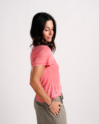 Coral acid wash short sleeve tee paired with olive drawstring pants, side view.