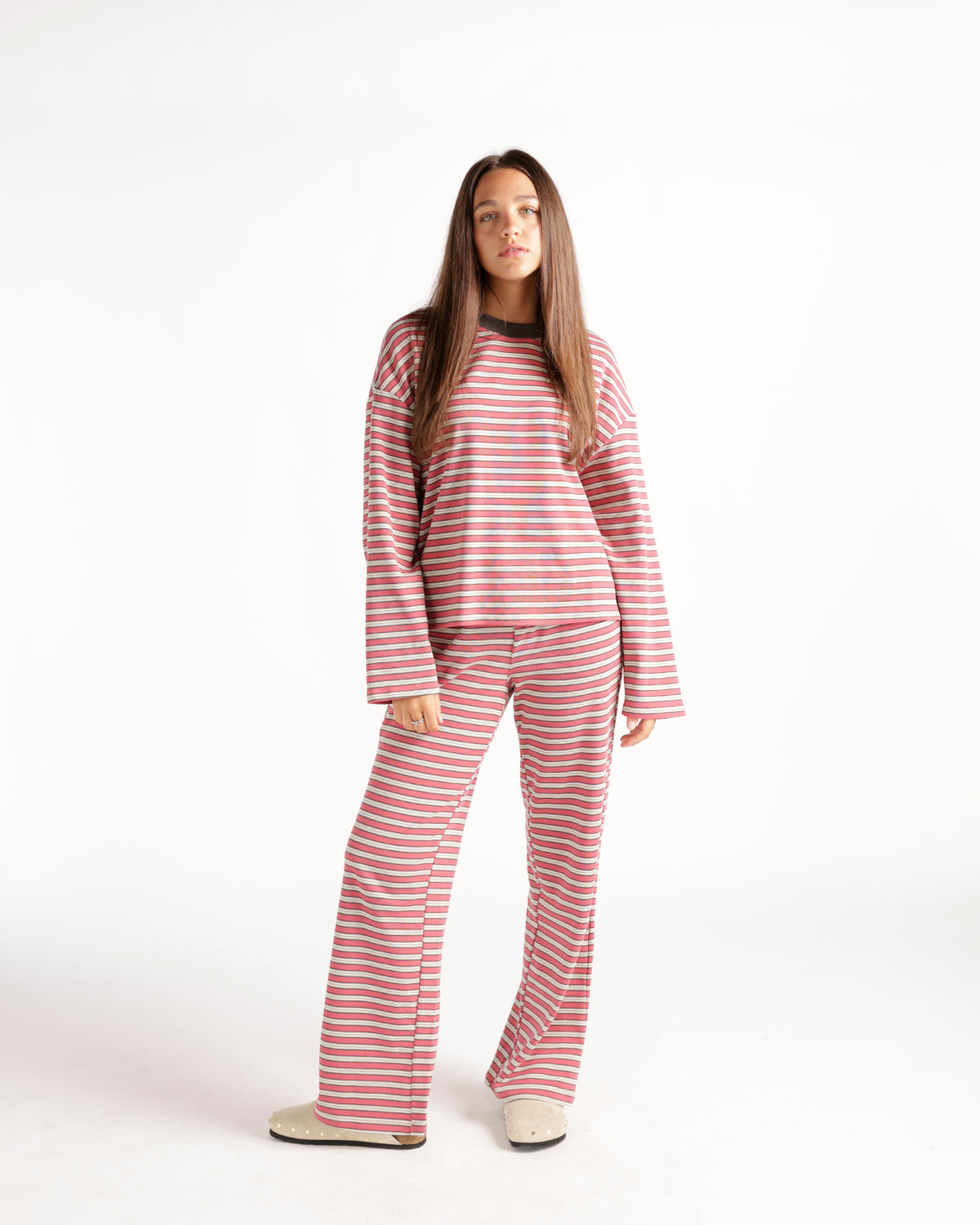 Pink striped wide-leg lounge pants with red and gray horizontal stripes