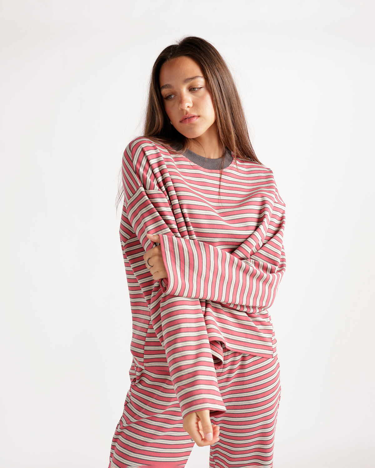Oversized pink striped long sleeve top with crew neck and relaxed fit