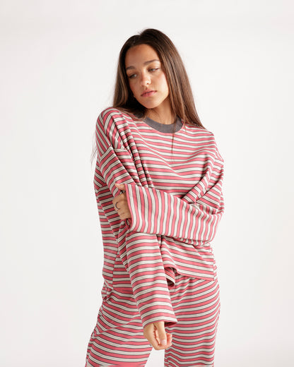 Oversized pink striped long sleeve top with crew neck and relaxed fit