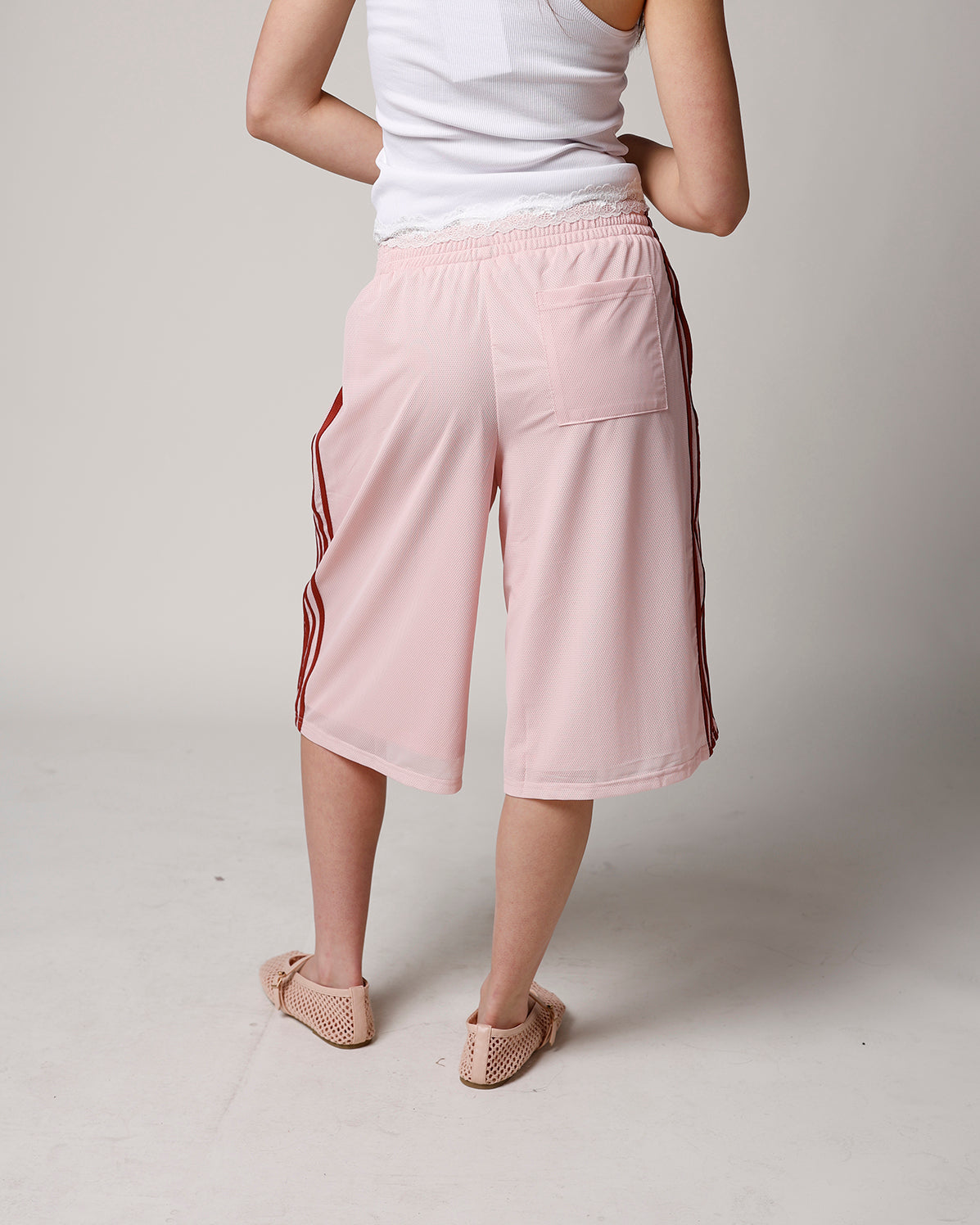 BLUSH LONGLINE MESH TRACK SHORT