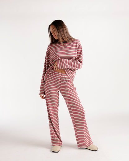 Pink striped wide-leg lounge pants with elastic waistband, full length