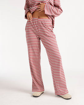 Relax in style with these red multi-stripe wide-leg pants featuring a comfortable elastic waistband, decorative button detail, and flowy silhouette. Pair them with the matching top or your favorite basics for an effortlessly cozy, everyday look perfect for lounging, errands, and weekend wear.