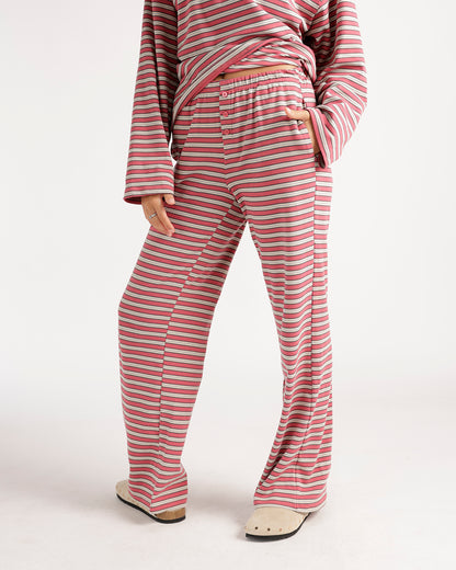 Pink striped lounge pants with elastic waistband, button fly, and wide leg fit.