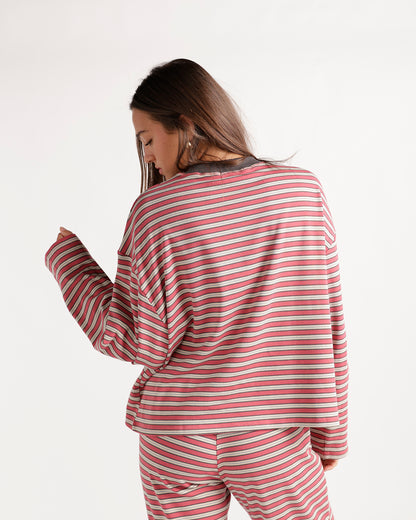 Pink striped long sleeve top with gray collar, worn as a matching set, back view.