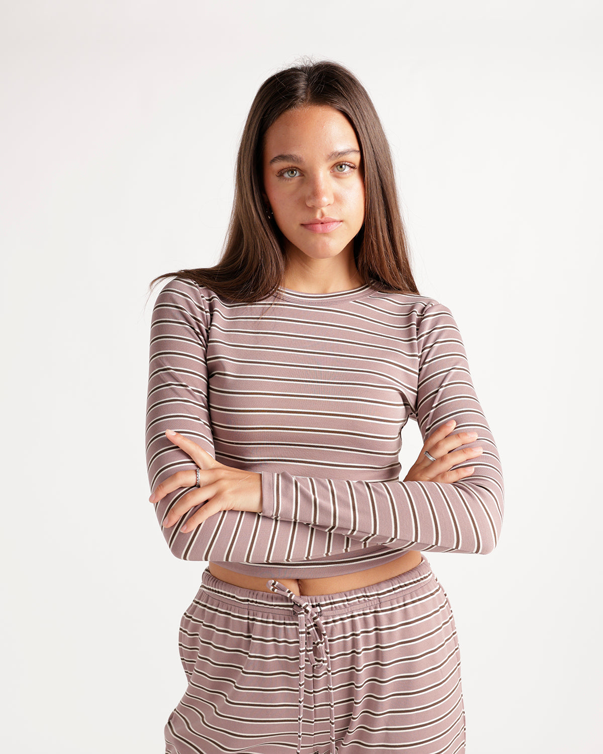 Mauve striped long sleeve crop top with ribbed texture, worn with matching bottoms